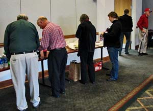 Photo of people serving themselves cake