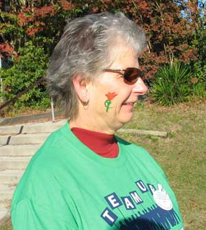 Carol Baker with red tulip painted on her face